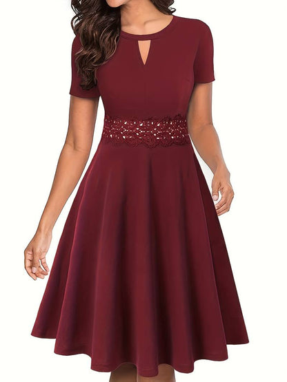 Chic Blue Dress Featuring Lace Accents and a Tailored Waist